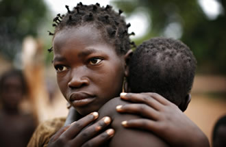Congolese girl holds her sister (Reuters by Finbarr O'Reilly).
