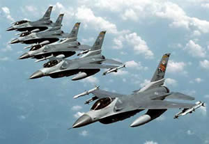 Five F-16 jet fighters in flight.