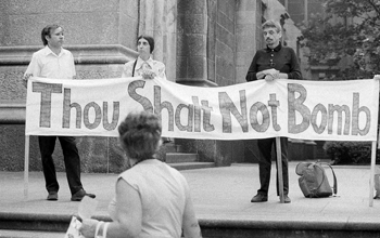 Vietnam war protesters with banner: "Thou Shalt Not Bomb."