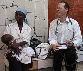Paul Farmer with mom and baby Quy Ton 12 2003