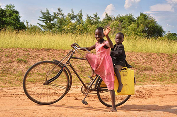 Girl and boy on a bicycle.