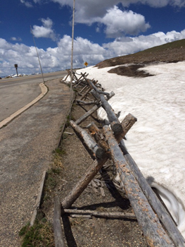 Snow and fence line in the Rocky Mountains.