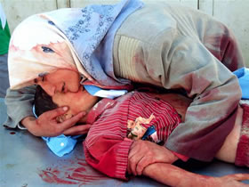 Iraqi mother weeps for her son who was killed by a sniper, September 2007.