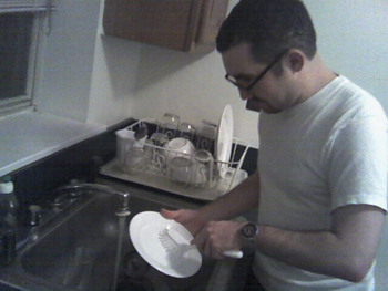 Man washing dishes.