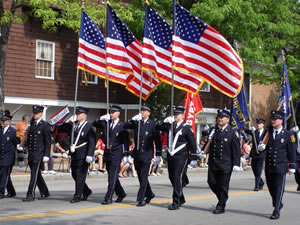 American flags carried in a Memorial Day parade