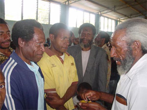 Receiving ashes in Papua New Guinea.