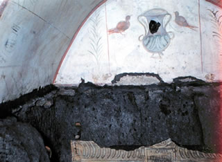Catacomb fresco of two doves, vase, palm branches.
