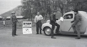 Armed militia create blockades on November 27, 1941 demanding that drivers acknowledge the legitimacy of the State of Jefferson.