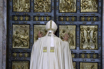 Pope Francis opens the Holy Doors.